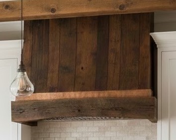 Rustic reclaimed custom range hood designed and built by cedar lane custom kitchens